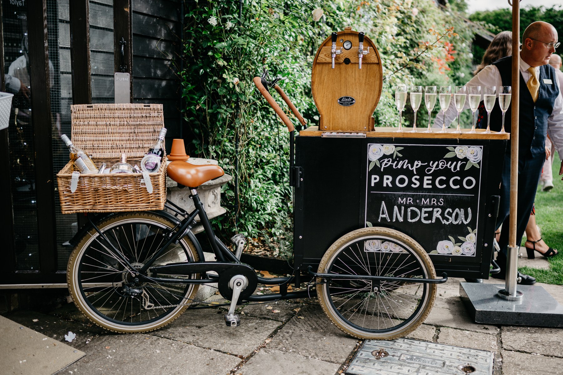 The Bubble Bike beside the black weatherboard barns at Winters Barns