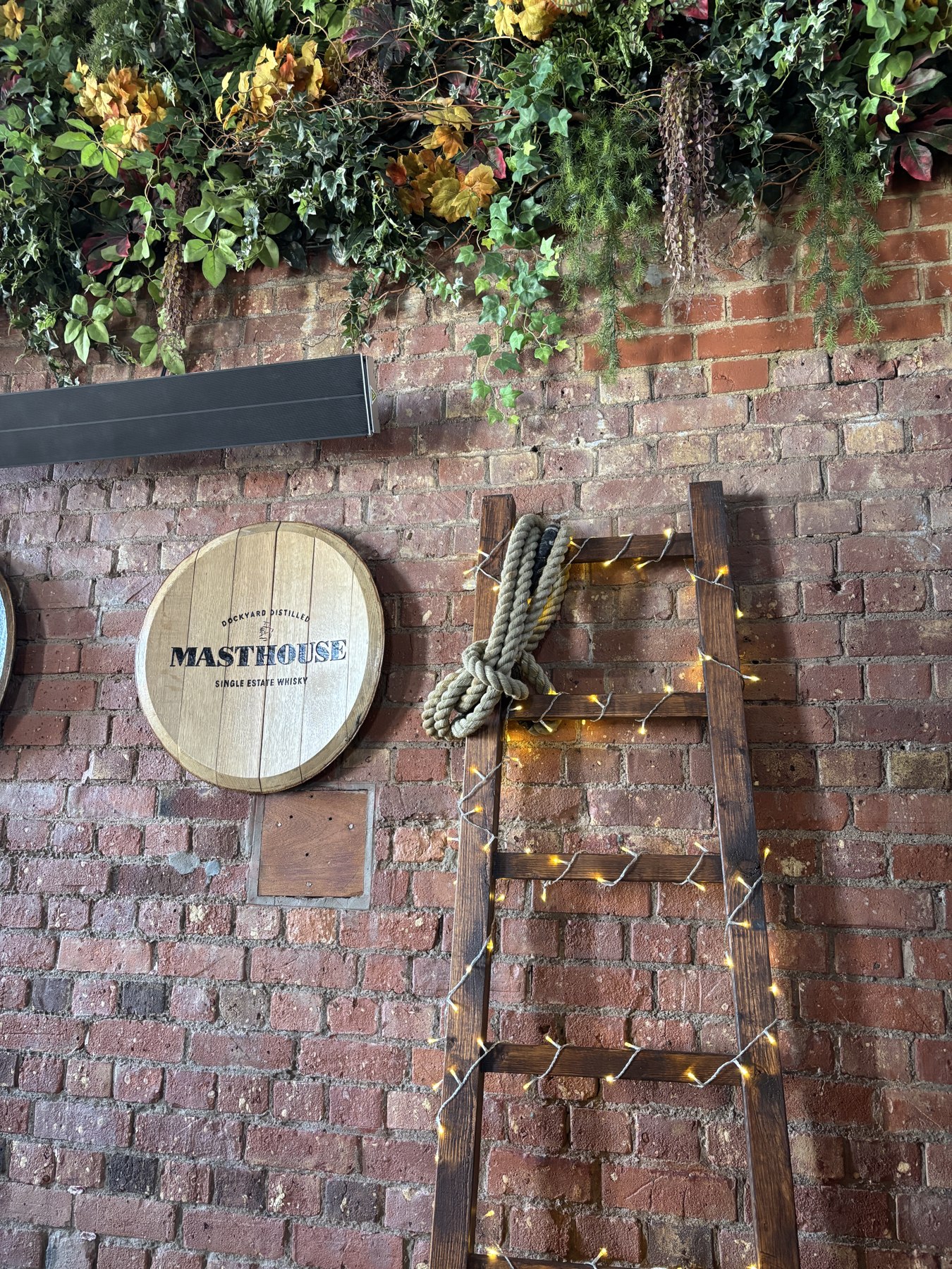 Wedding decorations against the brick walls at Copper Rivet Distillery