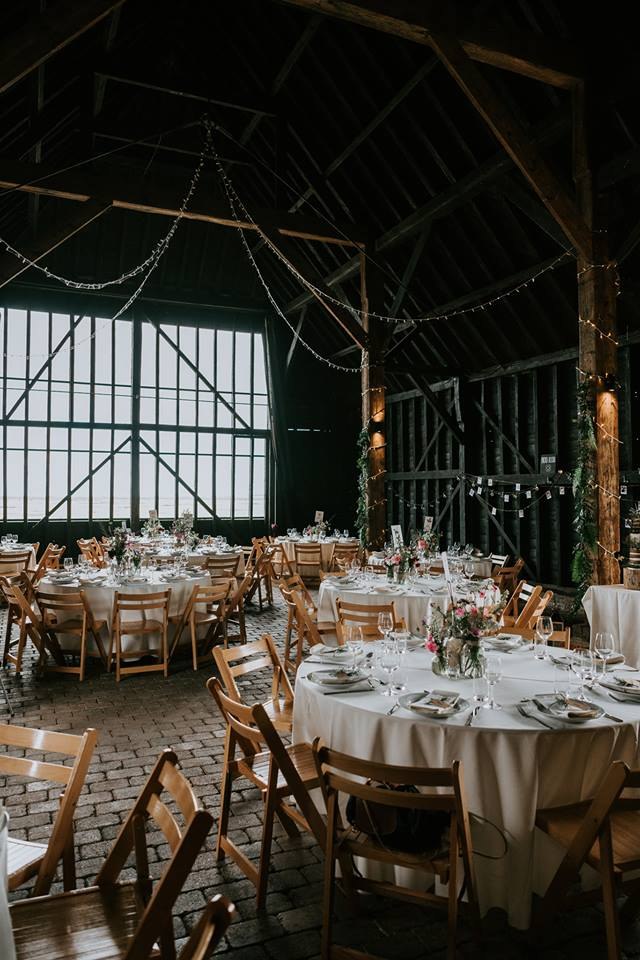 Wedding tables inside the barn at Elmley Nature Reserve