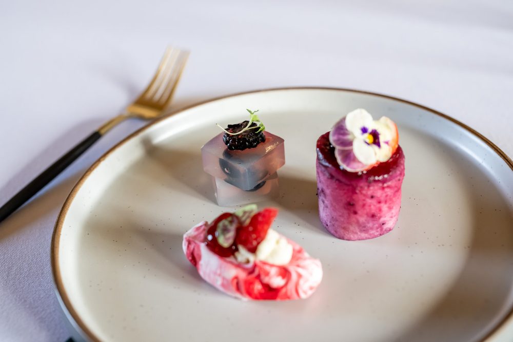 A trio of desserts on a beaded-rim plate