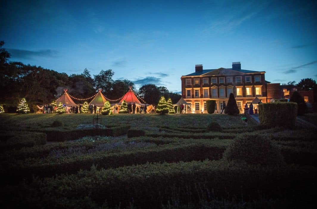 The house and reception tents at dusk at Goodnestone Park