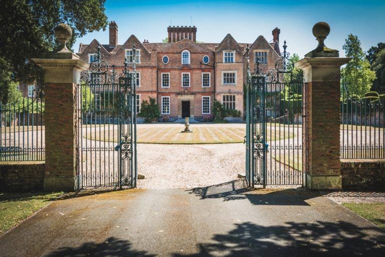 The house through its entrance gates at Knowlton Court