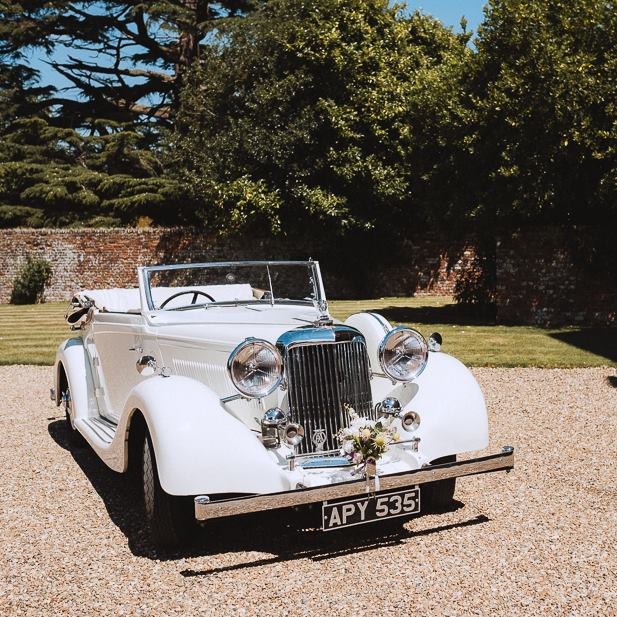A vintage wedding car in the grounds at Knowlton Court