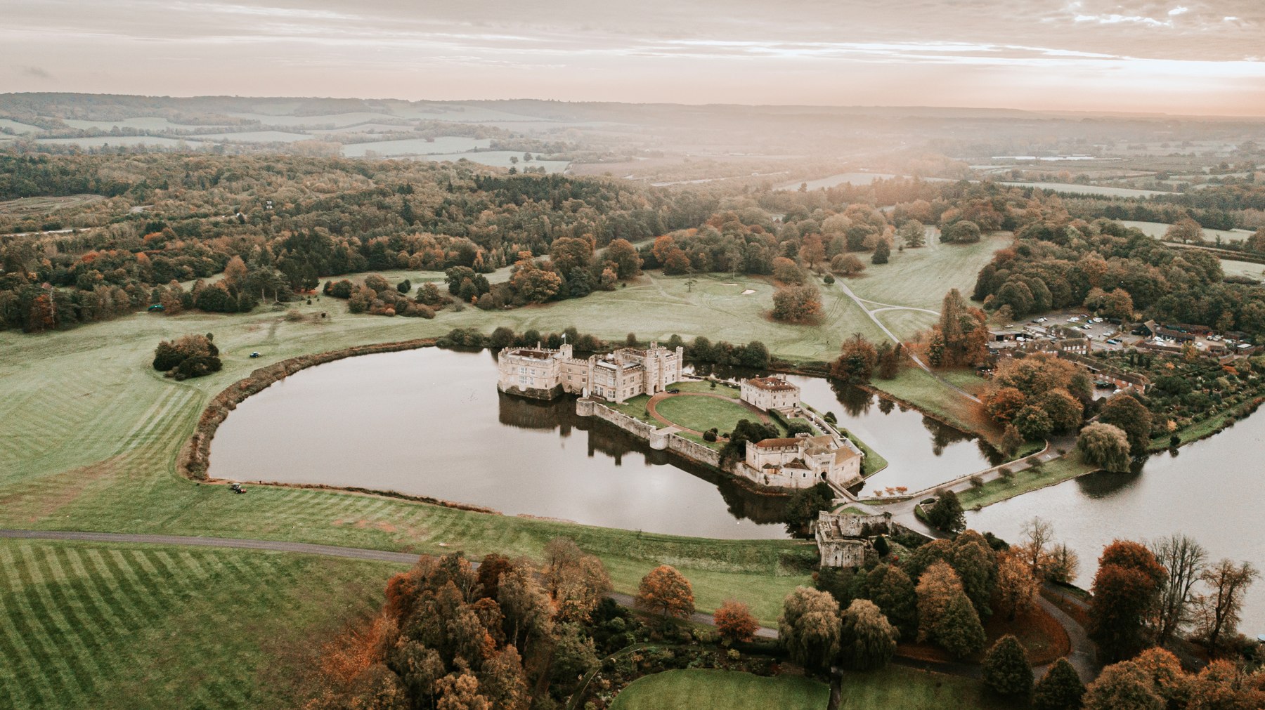 Leeds Castle surrounded by its moat and parkland