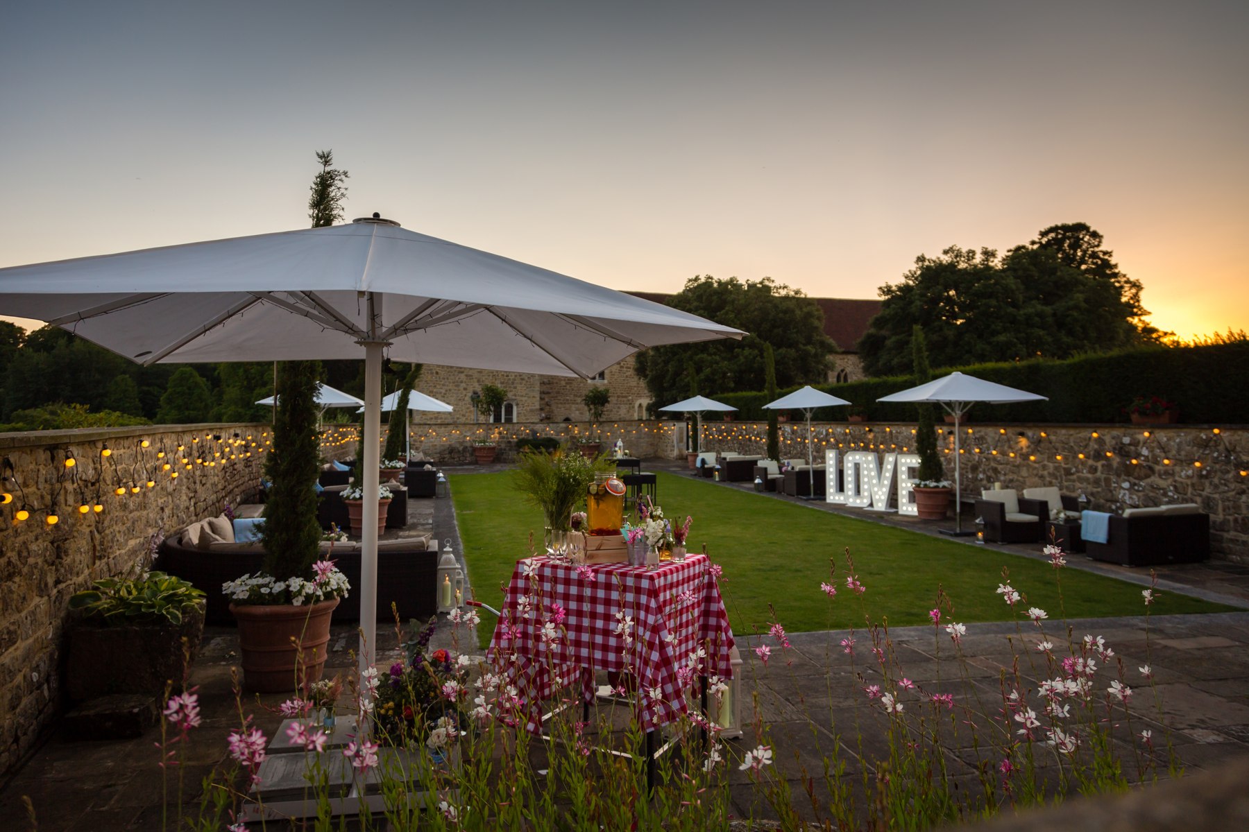 An outdoor reception at sunset at Leeds Castle
