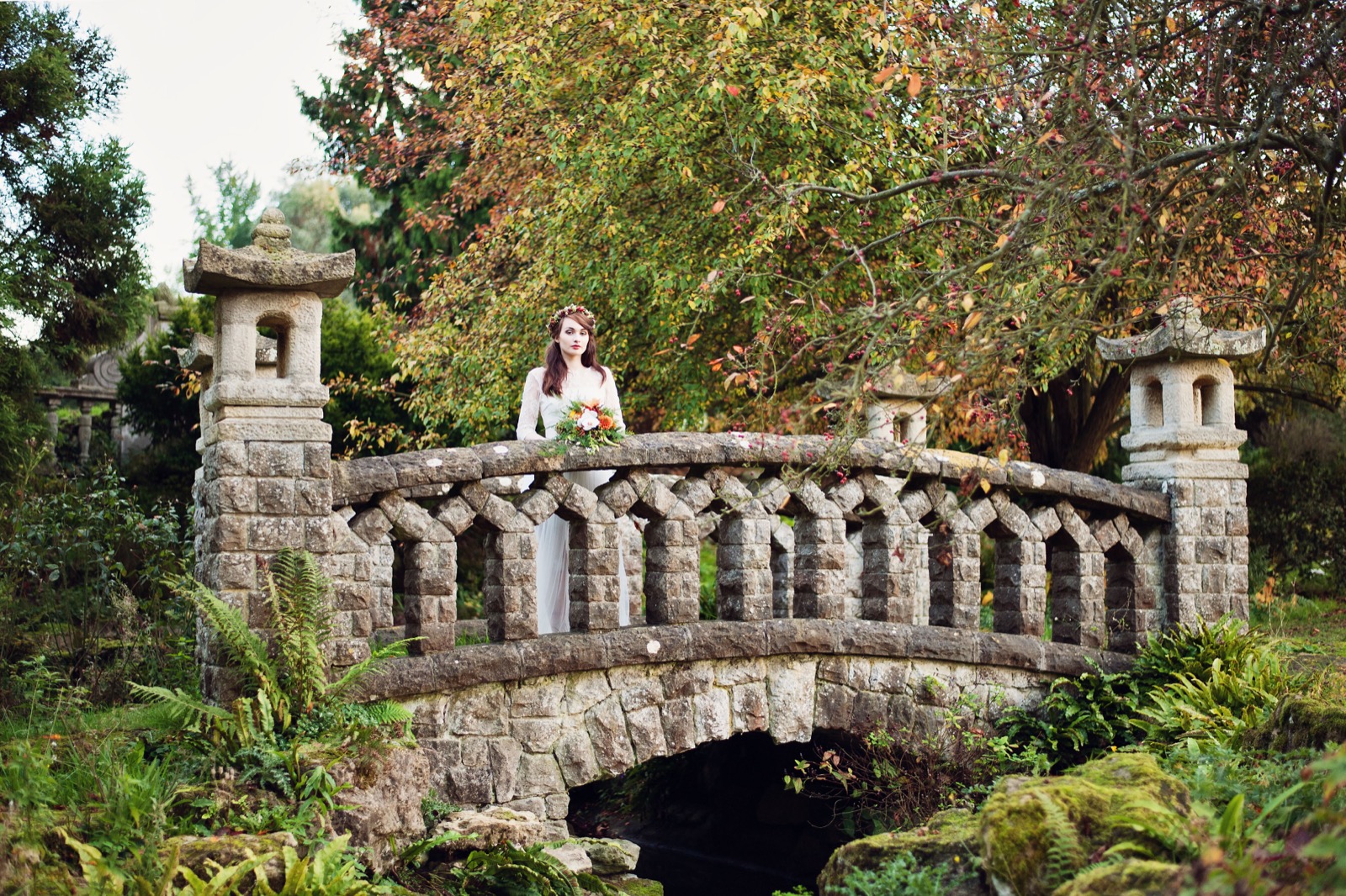 A bride on the stone bridge in Mount Ephraim gardens