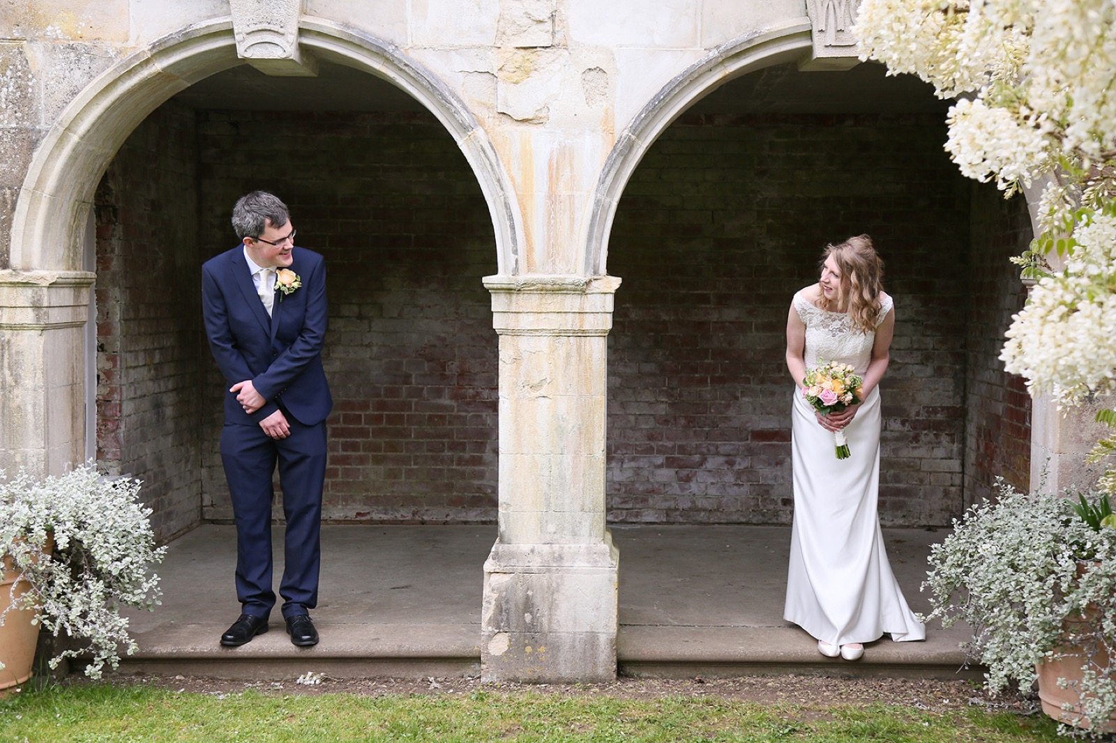 A couple beneath the stone arches at Mount Ephraim