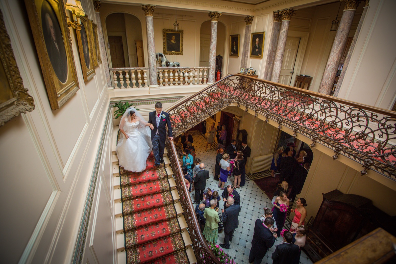 A bride descending the sweeping staircase at Mount Ephraim