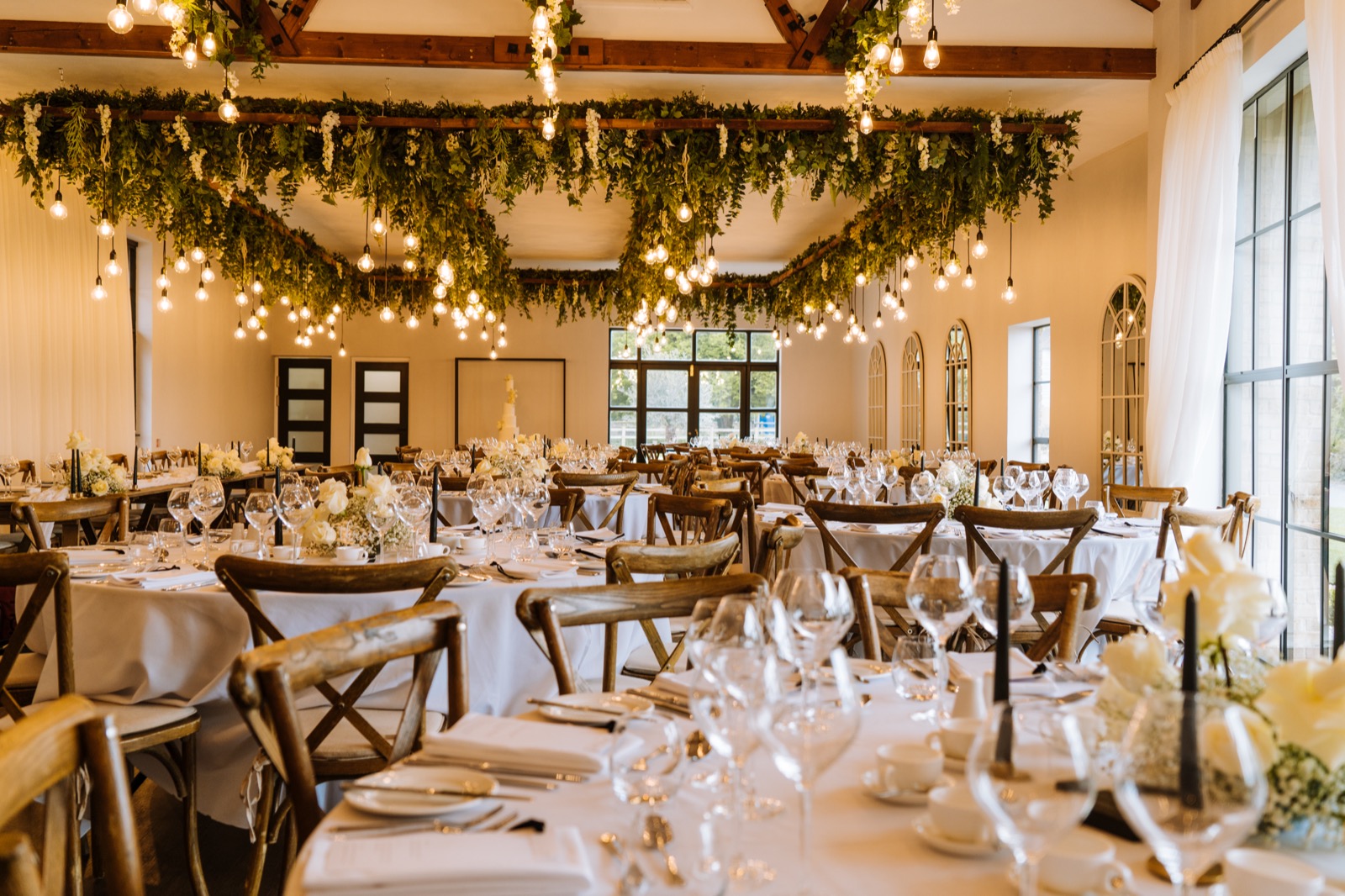 Wedding tables and greenery in the reception room at Oad Street