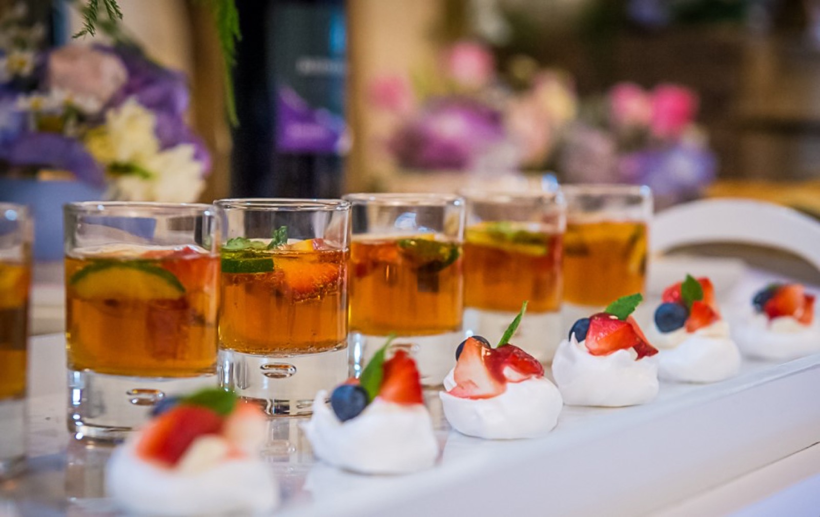 Individual desserts with berries and cream