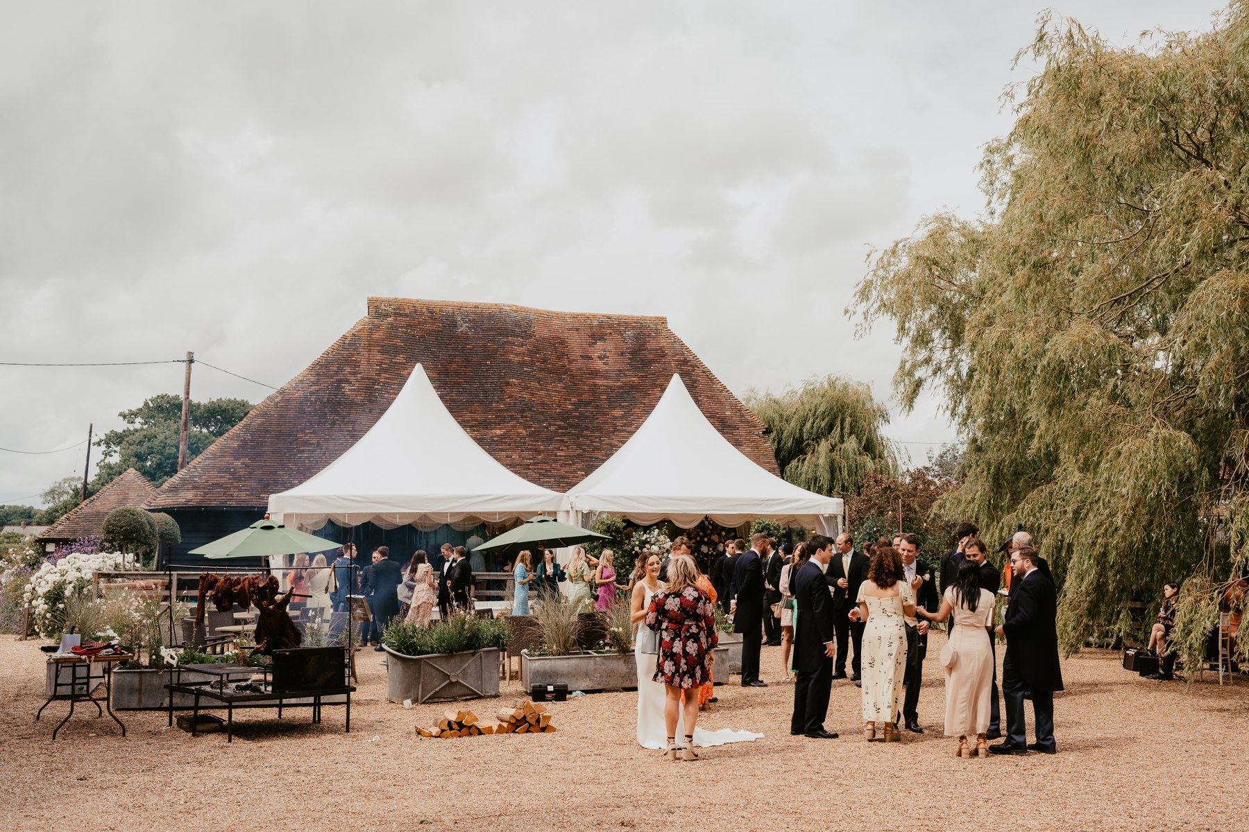 Guests outside the barn and reception canopy at Odo’s Barn