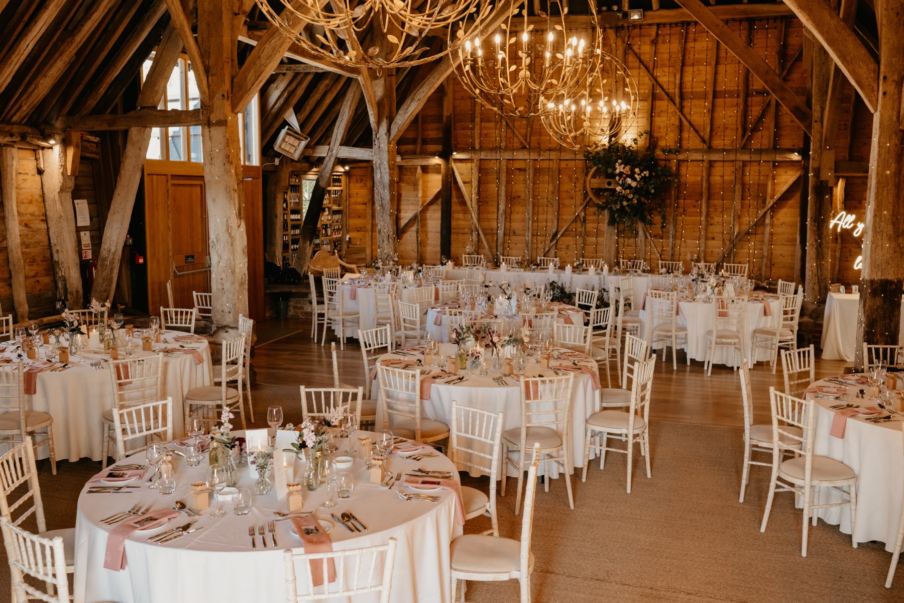 Round reception tables in the barn at Odo’s Barn