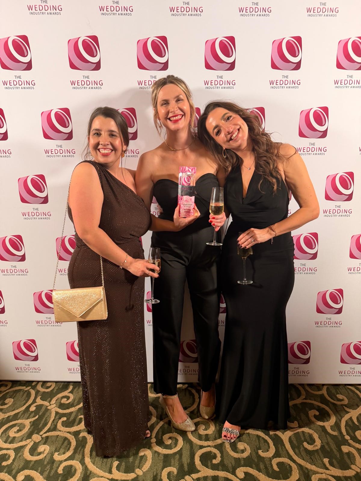 Chloe, Amy and Bryony celebrating with the 2026 Wedding Industry Awards trophy