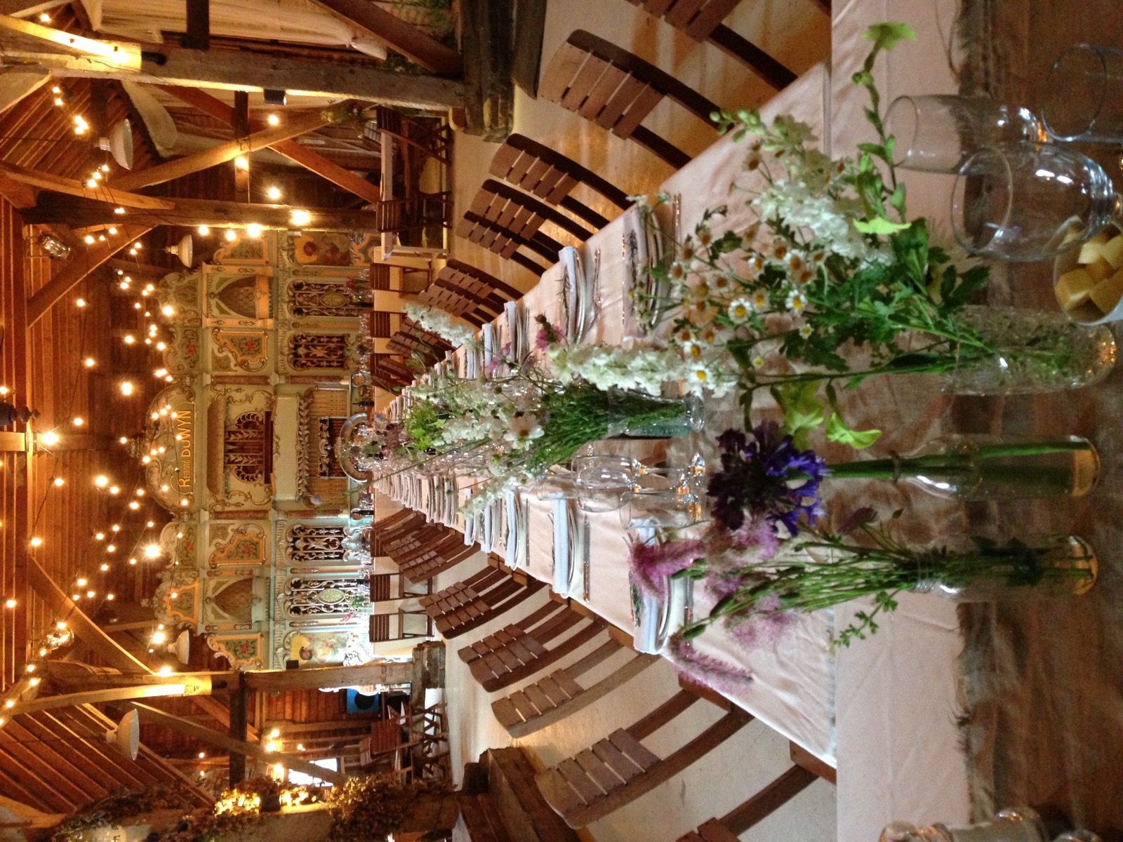 Long wedding tables and a vintage mechanical organ in the Kentish Barn