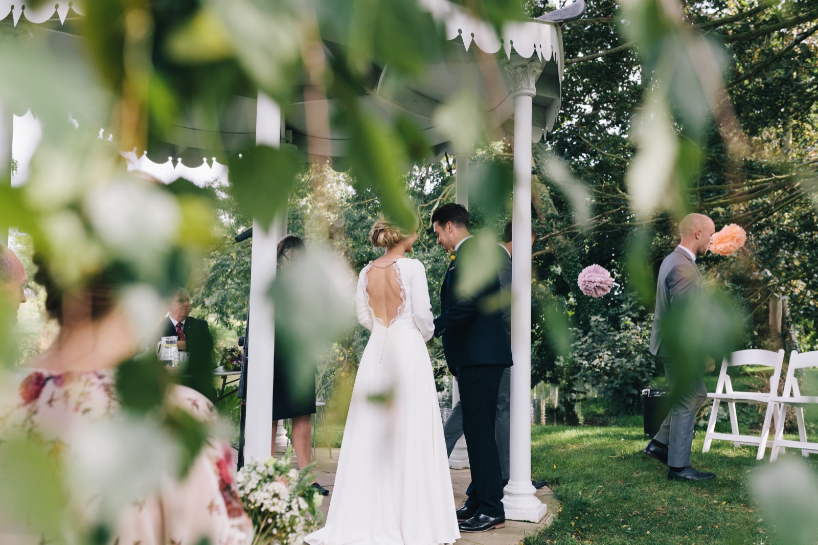 A garden ceremony framed by foliage at Preston Court