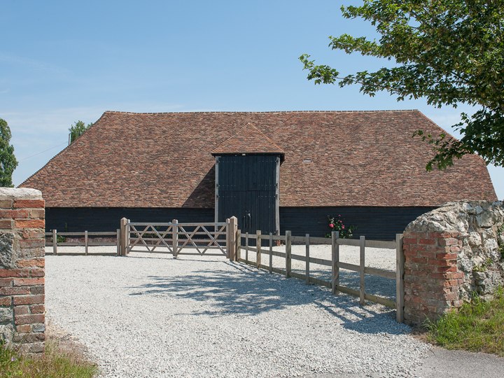 The barn exterior and courtyard entrance at Ruffynes Barn