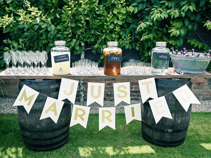 An outdoor drinks station with Just Married bunting at Ruffynes Barn