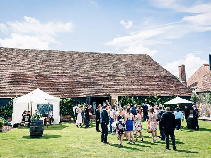 Guests gathered on the lawn beside the barn at Ruffynes Barn