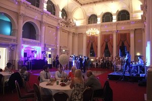 Guests dining beneath the chandeliers at The Corn Exchange