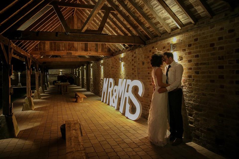 Wedding celebrations beneath the timber roof at The Night Yard