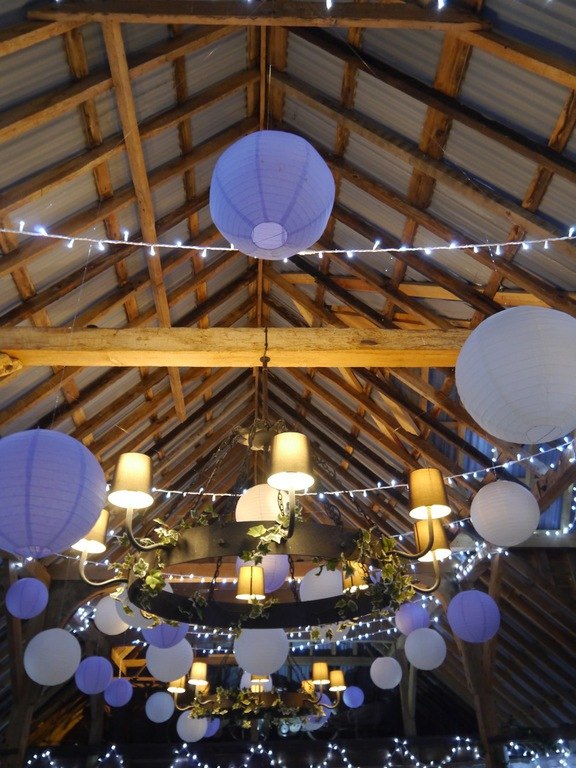 Colourful decorations beneath the barn roof at The Red Barn