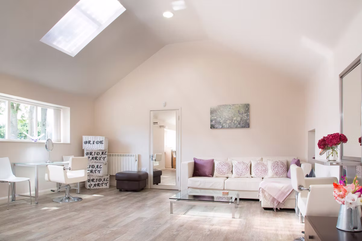 The light-filled salon with seating and dressing tables at Winters Barns