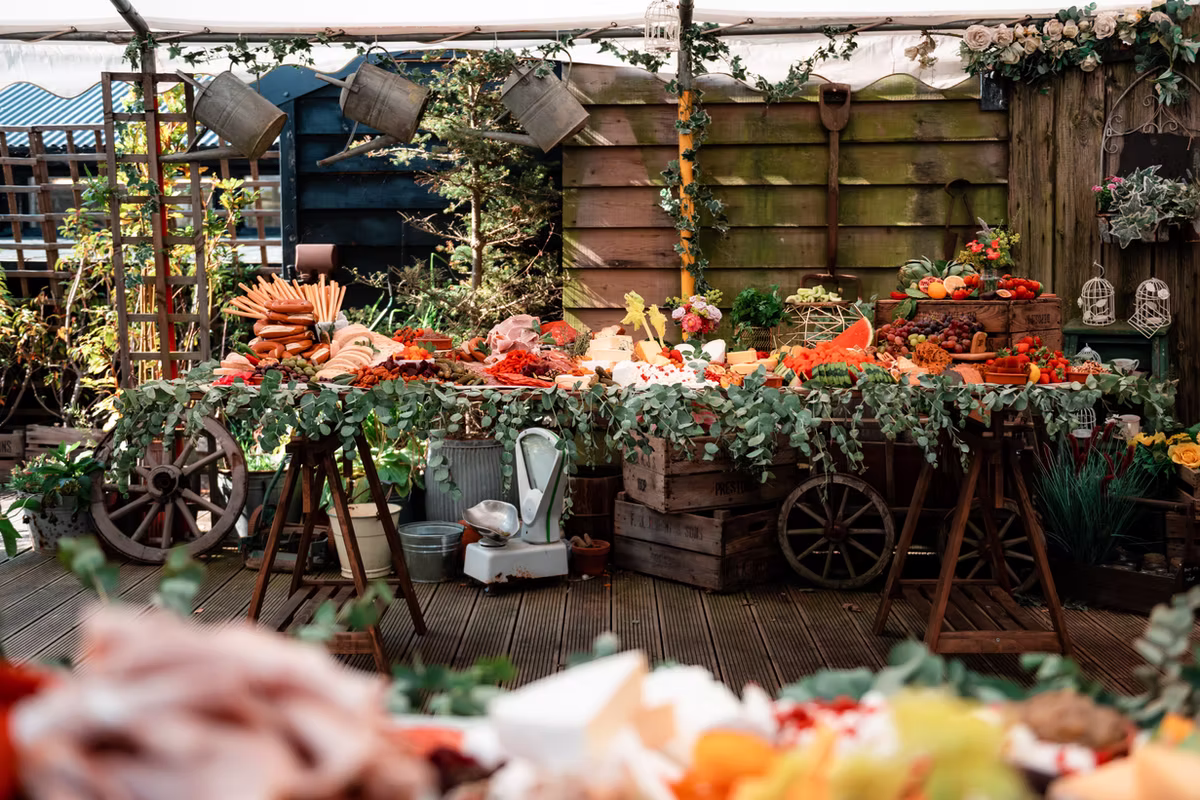 An outdoor grazing display with cheese, fruit and charcuterie at Marleybrook House