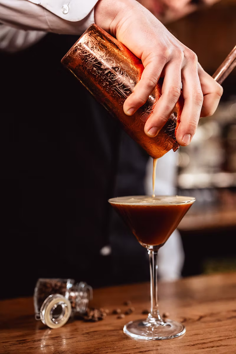 An Anderson’s bartender pouring an espresso cocktail